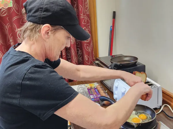 Community member cooking at Share Vancouver kitchen